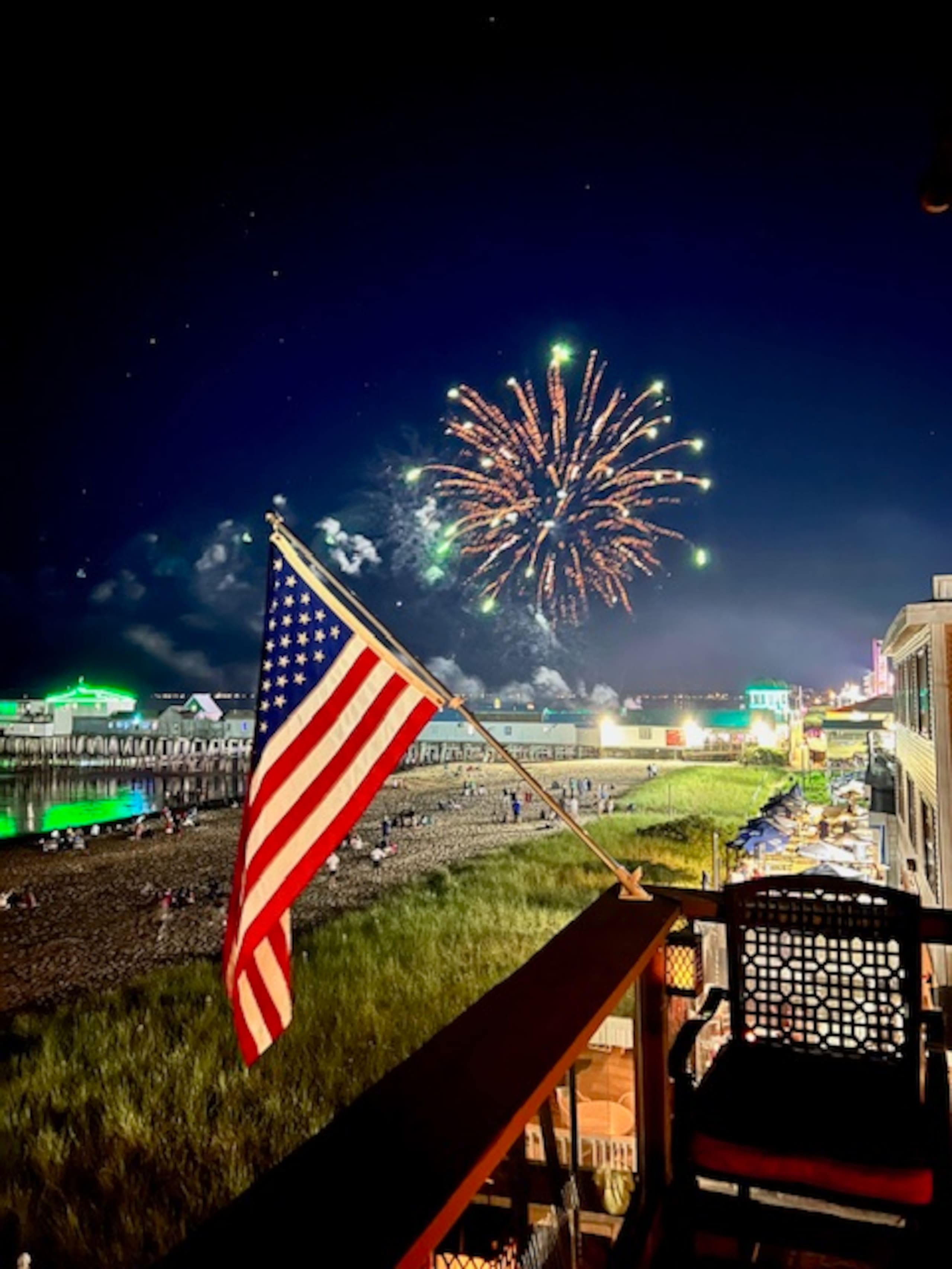 Fireworks display over the beach and pier