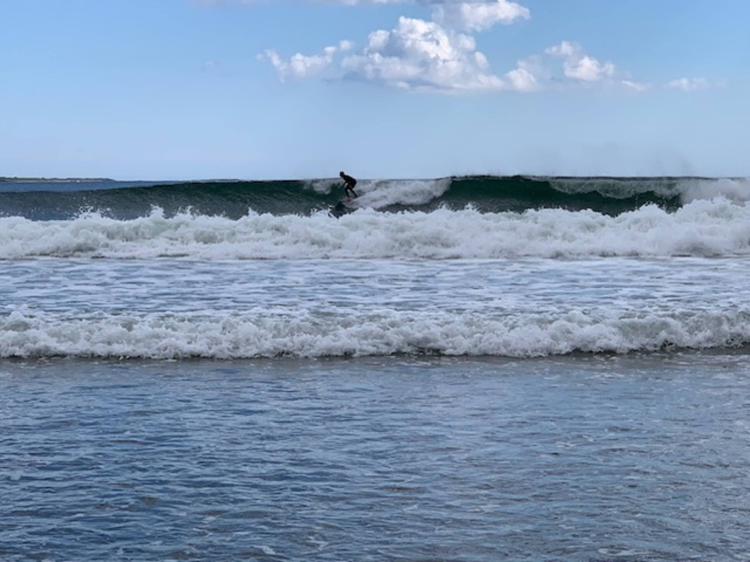 Surfer catching a wave